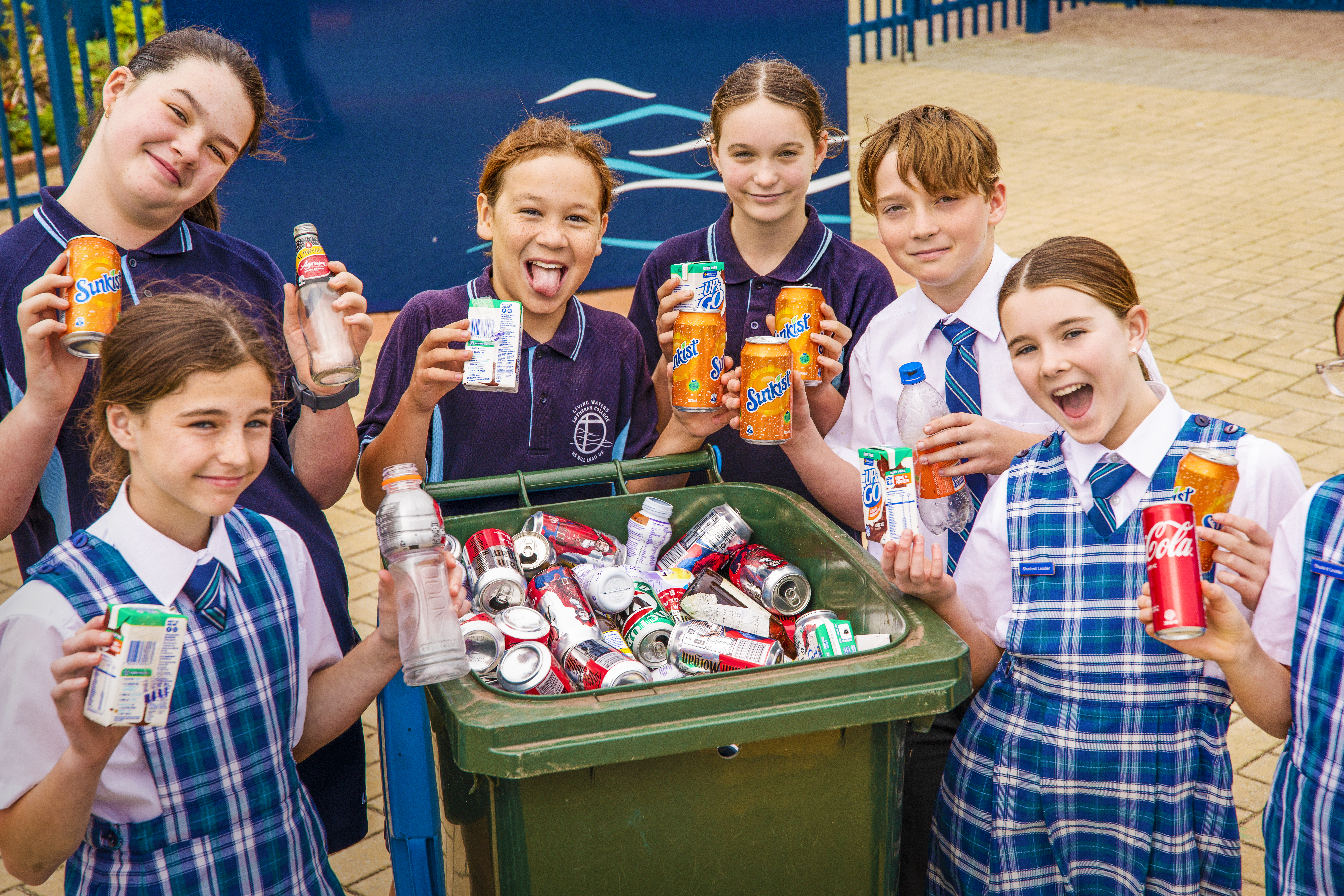 children with all the containers they have collected